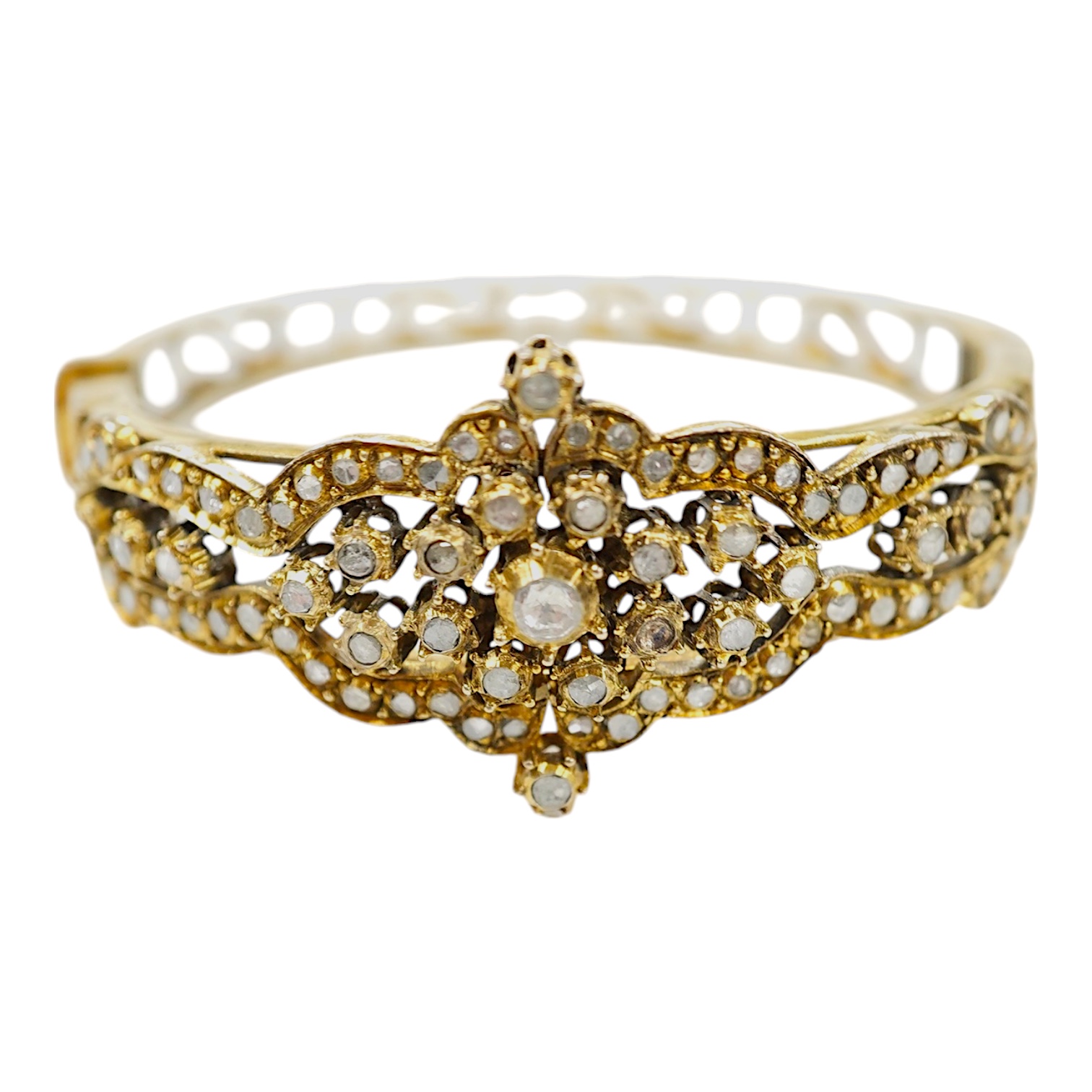 An Indian? gilt white metal and flat and rose cut diamond cluster set hinged bracelet. Condition - poor to fair